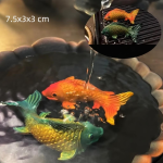 Farbwechselndes Teetier aus Kunstharz — Zwei orange-grüne Fische