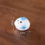 Schwein als Keramik-Teetier mit blauen Akzenten