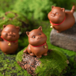 Tea-Pet-Katze in fünf Haltungen