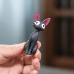 Tea Pet Schwarze Katze in sitzender Haltung