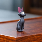 Tea Pet Schwarze Katze in sitzender Haltung