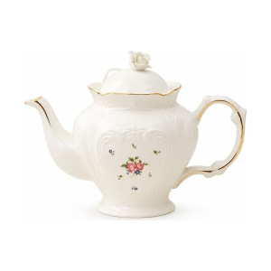 Teekanne oder Porzellantasse mit Untertasse im Blumenmotiv