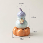 Teetier in Kürbisform mit Kristallglasur — Flieder, orangefarbener Sockel