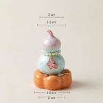 Teetier in Kürbisform mit Kristallglasur — Zartrosa, orangefarbener Sockel