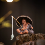 Teetier Jiang Taigong und Teesieb aus violettem Ton
